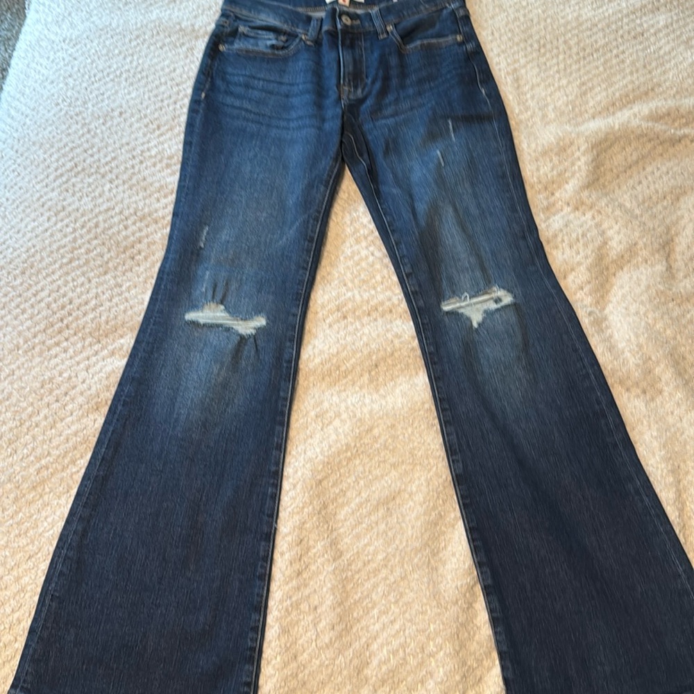 Lucky Brand “Sweet” Mid Rise Flare Jeans w distressing at knee.